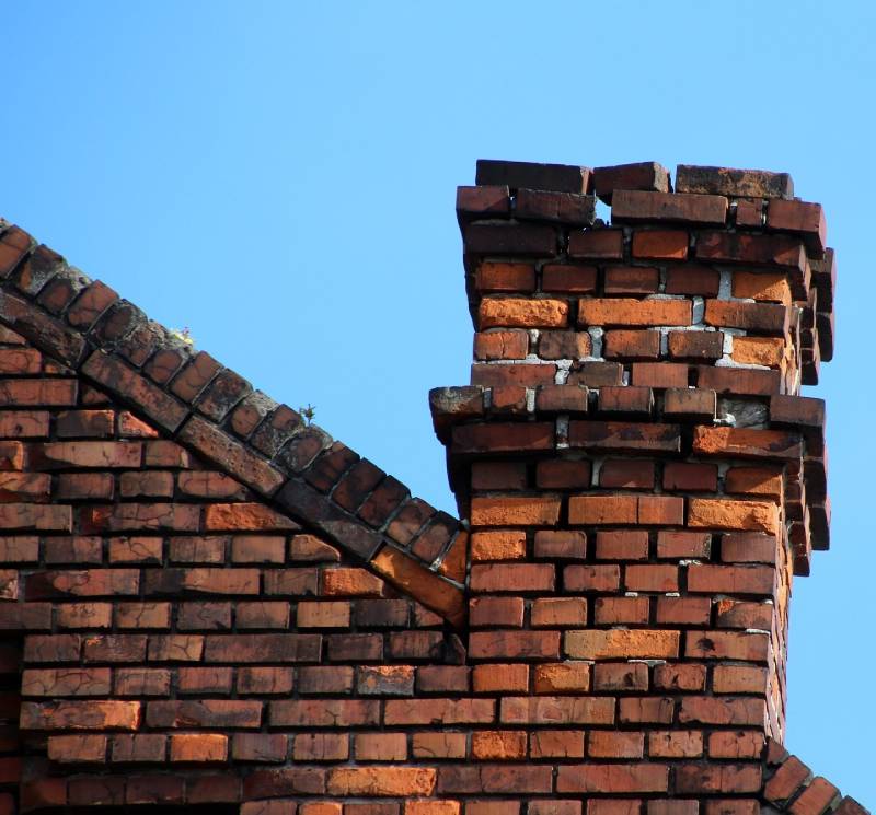 Signs Your La Palma Home Needs a Chimney Inspection Damaged chimney on an La Palma home showing cracks and missing mortar